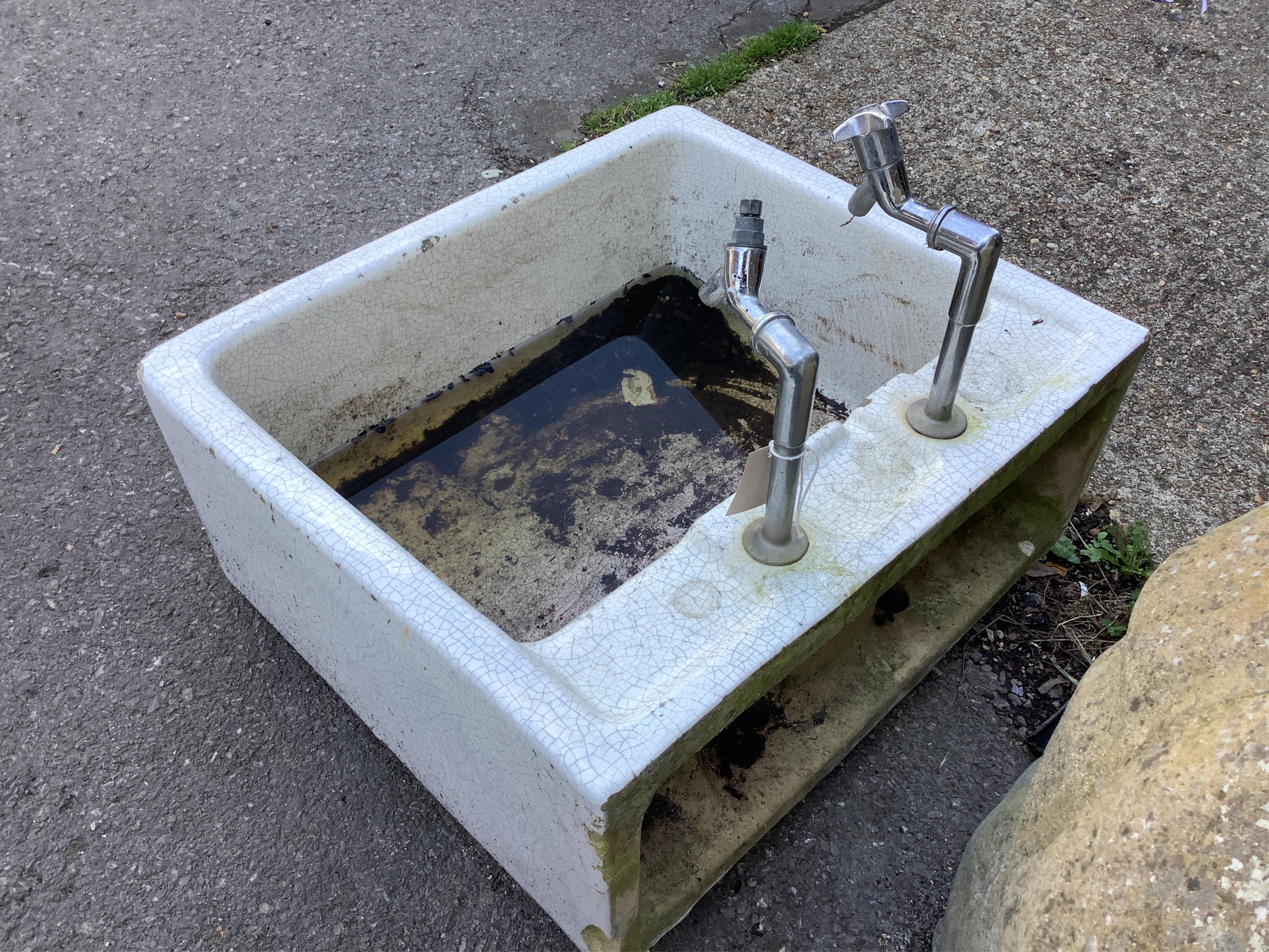 A rectangular enamelled sink, width 62cm, depth 56cm, height 28cm. Condition - fair